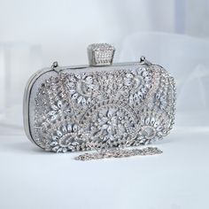 New to our Millennium collection, This beautiful romantic Silver Crystal Floral Leaves bridal clutch bag is made of very fine quality of crystal,  rhinestones, fabric and metal and it comes with Chain 46 inches long os cross body bag Detachable chain for your Big day! The Clutch measure about 7.5 inches long, 4 inches wide and thickness of the bag is 1.8 inches  ► ABOUT YOUR ORDER * All items are neatly packaged in our beautiful jewelry boxes and elegant organza bags. * All items are 100% gift-r Elegant Handheld Evening Bag For Events, Elegant Wedding Evening Bag With Openable Detail, Elegant Openable Evening Bag For Wedding, Elegant Wedding Evening Bag, Luxury Silver Shoulder Bag For Events, Luxury Clutch Evening Bag For Wedding Guest, Rectangular Clutch For Wedding, Luxury Handheld Clutch For Formal Occasions, Elegant Handheld Bags For Wedding Guest