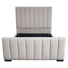 an upholstered white bed frame with black headboard and foot board in the middle