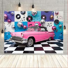 a pink car parked in front of a wall with musical notes on it