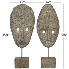 two african masks on stands with measurements