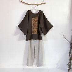 "Brown linen kimono top with gorgeous kimono silk panel ready to wear material: brown linen / kimono silk motif measurements: top width 48\"- 49\" top length 30\" wide sleeve 14.5\" kimono sleeve length from neck base to hem 23\" slits at side seams ginger linen bias reinforced neckline One of the kind ready to wear item Subscribe to my newsletter: https://linenclothingbyanny.com My Etsy shop: https://www.etsy.com/shop/linenclothingbyanny Both sites are handled by myself, feel free to contact me Linen Kimono, Over Size, Kimono Sleeve, Wide Sleeves, Linen Clothes, Ecuador, Kimono Top, Blouses For Women, Ready To Wear