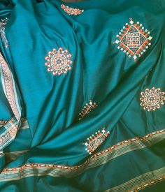 "Large shawl or hanging from India, probably Rajasthan. The colors are intense teal, more green than blue, orange, and white. The feel is soft, and it has a nice hand; a perfect layer for spring, summer, and fall. Fiber content is unknown, but I'm guessing it's mostly cotton--on first glance and touch I thought it was silk, that's the feel of it. Lightweight but closely woven, a bit shiny, and drapes beautifully. Tiny mirrors form the centers of the embroidered orange and white medallions. There Embroidered Orange, Drip Dry, Touch Me, Shawls And Wraps, Blue Orange, Womens Scarves, Portland, Scarf Accessory, Shawl