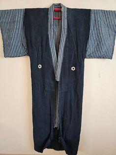 https://antiqueshopjunna.etsy.com Japanese Vintage BORO, YOGI. Night wear. It is made of thick cotton. 100% cotton. Vintage Condition is very good. Size: Body length 169cm Width 64cm Sleeve length 59cm YOGI: A nightwear worn when sleeping, or a kaimaki. Shipping: Items are shipped via International e-packet light. (Include Tracking) Delivery will take an AVERAGE of 2~3weeks. Caution: Import duties, taxes, and charges are not included in the item price or shipping cost. These changes are the buyer's responsibility. Please check with your country's customs office to determine what these additional costs will be prior to buying. Thank you Cotton Kimono With Kimono Sleeves For Loungewear, Long Sleeve Cotton Kimono With Pockets, Cotton Samurai Kimono With Long Sleeves, Cotton Samurai Style Long Sleeve Kimono, Samurai Style Long Sleeve Cotton Kimono, Cotton Kimono With Natural Dye And Kimono Sleeves, Traditional Cotton Robe With Kimono Sleeves, Blue Cotton Kimono For Daywear, Cotton Samurai Kimono With Kimono Sleeves