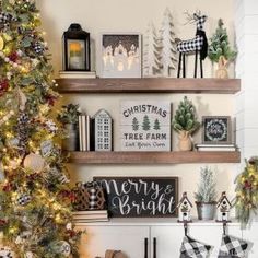 the christmas tree is decorated with black and white ornaments, plaid stockings, pine cones, deer head decorations, and other holiday decor