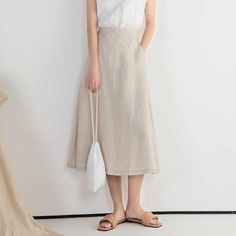 "DETAIL * 100% Linen * Back elastic * Two side pockets * A Line skirt * Below knee length skirt * Wash by hand or machine with cold water * The model is 170cm (5′ 7″) tall with a 66cm (26\") waist. She is wearing a XS/S in natural color. * Choose CUSTOM Order if you Need a better fit Can't find your size in our size Chart Change the Style Chang the Length Your Height is not Between 5'1\" - 5\"9\" SIZING AND FIT, Garment size as follow XS/S Waist 66-71cm Hips 100cm Length 75cm Weight suggest with Summer Bottoms With Pockets, Midi Length, Casual Knee-length Pencil Skirt With Pockets, Knee-length Pencil Skirt With Pockets For Summer, Spring Knee-length Pencil Skirt With Pockets, Chic Midi Pencil Skirt With Pockets, Chic Long Pencil Skirt With Pockets, Chic Midi-length Pencil Skirt With Pockets, Spring Midi Skirt With Pockets, Spring Midi Pencil Skirt With Pockets