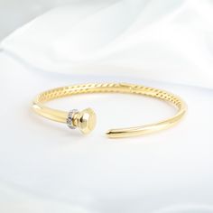 Slip into effortless elegance with our Gold Diamond Wrap Bangle—a perfect harmony of comfort and sophistication. Thoughtfully crafted with a hinged design for an impeccable fit, this timeless piece graces your wrist with ease while showcasing the brilliance of carefully set diamonds. The classic utilitarian-inspired design is elevated with a touch of sparkle, creating a piece that feels as good as it looks. A forever accessory, this bangle is destined to remain a cherished part of your collectio Wrap Bangles, Broken Chain, Demi Fine Jewelry, Perfect Harmony, Effortless Elegance, Timeless Accessories, Go Out, Out Of Style, Timeless Pieces