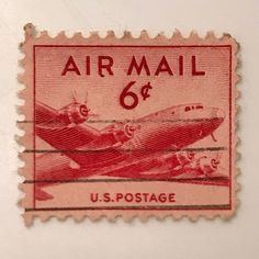 an airmail stamp with the u s postage logo