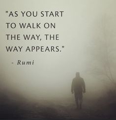 a man walking down a foggy road with a quote from rumi on it