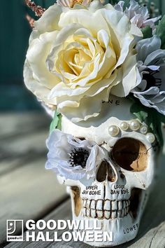 there is a skull with flowers in it