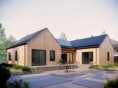 a wooden house with a table and chairs in front of it