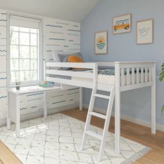 a white bunk bed sitting next to a window in a room with blue walls and wooden floors