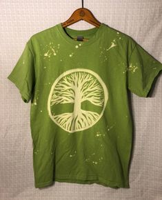 Unisex Medium Green 6 oz. 100% Cotton T-shirt  Bare Tree of Life painted by hand & splattered with bleach Shirt has been washed to ensure full bleach removal from fabric Artistic Tie Dye Cotton Tops, Relaxed Fit Green Bleached Tops, Painting Shirt Ideas, Green Bleached Crew Neck Top, Hand Dyed Cotton T-shirt, Bleached Cotton Crew Neck T-shirt, Hand Dyed Cotton Crew Neck T-shirt, Bleach Art Clothes, Green Bleached Cotton T-shirt