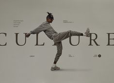 a young man is doing a kick in front of a large sign that says culture