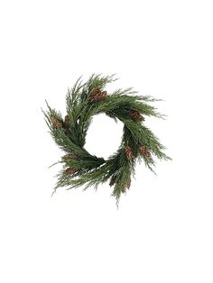 a pine wreath is hanging on the wall