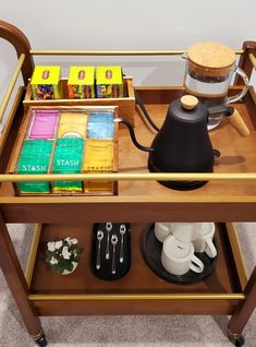 Tea bag organizer, gooseneck electric kettle, marble tray, wooden and golden bar cart. Small Coffee Tea Station, Tea Corner In Living Room, Yea And Coffee Bar, Tea Set In Bedroom, Tea Tray Display Coffee Stations, Small Tea Corner Ideas, Tea Station Office Desk, Bar Cart Tea Station, Bar Cart For Coffee