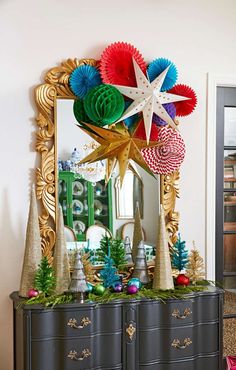 an ornate dresser with christmas decorations on top