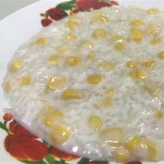 a white plate topped with rice and corn