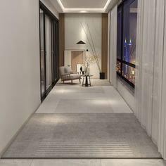 a long hallway with white walls and flooring