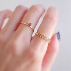 a woman's hand with a ring on it