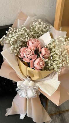 a bouquet of flowers sitting on top of a table