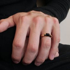 Read about our payment plans before proceeding.A beautiful sleek beveled ring band tapering from 7~3mm holds a natural custom cut onyx. Custom cut in a pyramid cabochon shape. A simple and classic design for a stylish man who wants a ring that's unique but doesn't stand out too much. Handcrafted in sterling silver and 14K solid gold. Materials:- Sterling silver and 14k solid gold- Natural cabochon pyramid cut onyx- 7~3mm tapered beveled bandwidth ** Tippy Taste Men's are made-to-order. Please al Minimalist Black Couple Rings For Anniversary, Minimalist Onyx Signet Ring For Formal Events, Minimalist Onyx Signet Ring For Formal Occasions, Minimalist Onyx Rings For Formal Occasions, Minimalist Onyx Ring For Formal Occasions, Bevel Ring, Onyx Ring Men, Man Ring, Stylish Man