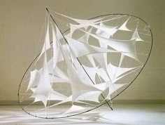 an artistic sculpture made out of white paper