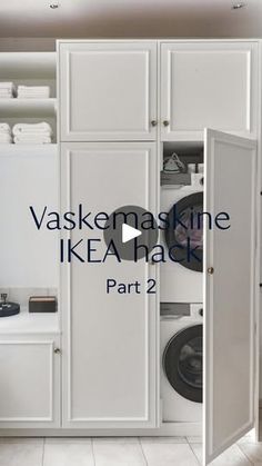 a washer and dryer sitting inside of a white cabinet next to a toilet