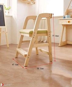 a child's wooden chair with measurements for the seat and footrests on it