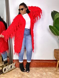 Elevate your wardrobe with our Glamorous Fringe Knit Cardigan, the epitome of effortless elegance. The delicate fringe detail adds a touch of sophistication, making it versatile for various occasions. Whether you're dressing up for a special event or adding a layer of warmth to your everyday look, this radiant cardigan will become your favorite go-to piece. Long sleeves 100% Polyester Very good stretch for ease of movement Safe to size down Color: Black, Mocha & Red Oversized Fringe Cardigan For Fall, Cozy Fringe Cardigan For Fall, Chic Fringe Cardigan, One Size Long Sleeve Cardigan With Fringe, Black Fringe Long Sleeve Cardigan, Fringe Cardigan, Long Sleeve Knitted Cardigan, Photo Lighting, Good Stretches