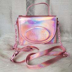 -Super Cute Holographic Iridescent Pink Chrome Bag With "Steve Madden" Embossed Logo On The Front -Bag Has Adjustable/Detachable Chainlink Faux Patent Leather Strap -Bag Can Be Worn As A Crossbody Bag, Shoulder Bag, Or As A Handbag -Inside Has One Zippered Wall Pocket With Two Sleeve Pockets -Has Magnetic Snap Closure -Has Matte Pink Hardware -New With Tags Dimensions: W:8" H:6½" D:3" Trendy Iridescent Bags, Iridescent Rectangular Shoulder Bag For Party, Trendy Iridescent Party Bag, Hot Pink Chrome, Leather Strap Bag, Holographic Iridescent, Pink Chrome, Matte Pink, Steve Madden Bags