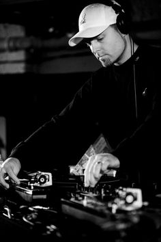 a man that is standing in front of a dj's turntable