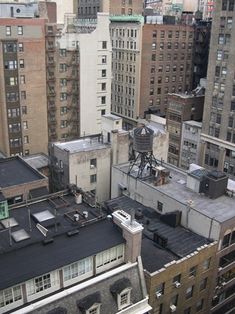 an aerial view of buildings and rooftops in new york city