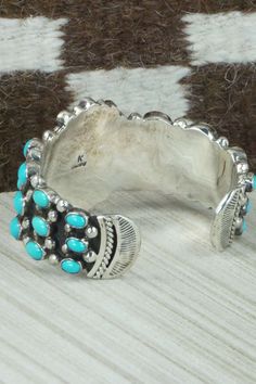 This vintage sleeping beauty turquoise and sterling silver bracelet was made by Navajo silversmith Kenneth Jones. The inside is signed K and stamped sterling. Please note this is a pre-owned piece, with patina, in vintage condition.Size: 5 5/8" (will fit up to a 6 5/8" wrist)Gap: 1"Length: 1 1/2"Free shipping on all orders! We ship with USPS and always include tracking. All orders ship within a day of payment.Returns are accepted up to 30 days after you receive your order. Just send us a message Genuine Turquoise And Sterling Silver Bangles, Vintage Navajo Jewelry Bracelets Links, Vintage Sleeping Beauty, Vintage Turquoise Jewelry, American Indian Jewelry, Native Style, Native Jewelry, Sleeping Beauty Turquoise, Vintage Turquoise