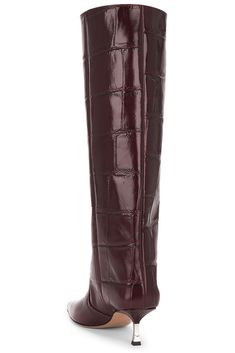 Find PARIS TEXAS Bettina Boot 55 In Burgundy on Editorialist. Paris Texas Bettina Boot 55 in Burgundy Croc-embossed leather upper with leather sole. Made in Italy. Pull-on styling. Leather lining. Pointed toe. Kitten heel. Approx 55mm/ 2.2 inch heel Approx 407mm/ 16.1 inch shaft Shaft measures approx 15.7 in circumference. PSTF-WZ267. PX1369. About the designer: Italian-based footwear brand, Paris Texas mission statement is simple: to enhance and simplify the dynamic lives of the modern woman. Bold, sophisticated and versatile styles emanate from each design conveying a confident attitude engrained in its DNA. Centered around the freedom of self-expression, the core emphasis of the brand creates new rules that break the traditional office-and-leisure wardrobe separation, where designs can Luxury Fitted Knee-high Boots With Leather Lining, Elegant Faux Leather Knee-high Boots For Formal Occasions, Luxury Textured Leather Boots For Formal Occasions, Luxury Textured Leather Formal Boots, Formal Textured Leather Boots, Designer Leather Knee-high Boots For Formal Occasions, Burgundy Leather Heeled Boots For Formal Occasions, Elegant Burgundy Boots With Leather Lining, Elegant Burgundy Leather Heeled Boots