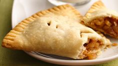 two pieces of pie sitting on top of a white plate