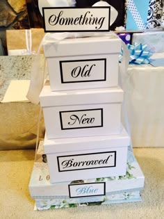 three white boxes stacked on top of each other with the words bridal shower gifts wrapped in