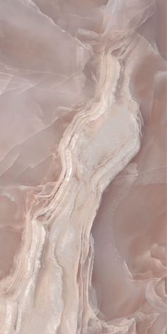 an abstract painting with white and pink colors on the surface, as if it were painted in pastel tones