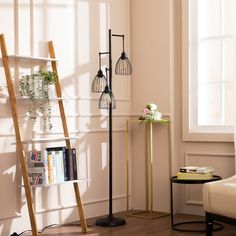 a living room with a ladder, bookshelf and two vases on the floor