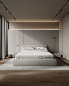 a large white bed sitting inside of a bedroom