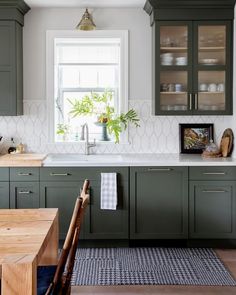 a kitchen with green cabinets and the words, how to choose the right paint color for your