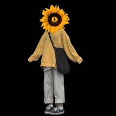 a person wearing a sunflower mask and carrying a black bag on their head, standing in front of a black background