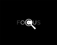 a magnifying glass with the word focus in white on a black background,