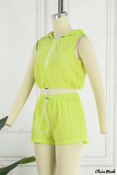 Olivia Mark - Ebony Hooded Sleeveless Two-Piece Set with Contemporary Solid Design Sporty Green Vest For Spring, Sleeveless Top With Drawstring Hood For Spring, Hooded Solid Color Vest For Spring, Fitted Hooded Vest For Spring, Fitted Hooded Spring Vest, Sporty Sleeveless Top With Drawstring, Sporty Sleeveless Vest For Spring, Sporty Sleeveless Spring Vest, Green Sleeveless Top With Drawstring