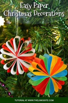 colorful ornaments hanging from a christmas tree in the shape of flower ornament decorations