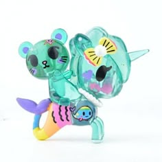 a glass figurine of a cat and fish holding each other's tail