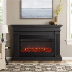 Part of the Real Flame Landscape Series, the Beau Electric Fireplace has a large mantel top and extra wide infrared electric firebox – 15 in. wider than the standard Real Flame firebox. The Beau is certain to make any room warm and cozy. Hassle-free assembly and adjustable heat settings are just a few of the benefits of this classic fireplace. Finishes available include Dark Walnut, Gray, and White. Real Flame 58.5-in W Gray Free Standing Fan-forced Flat Wall Electric Fireplace with Remote Contr Electric Fireplace With Mantel, Grey Fireplace, Classic Fireplace, Wall Mount Electric Fireplace, Real Flame, Wood Burning Fires, Stove Fireplace, Indoor Fireplace, Fireplace Inserts