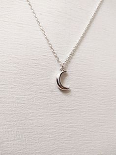 ◆ Necklace with small half moon plated in silver this necklace is very simple and elegant and has an adjustable silver chain the moon size is only 0,629921 inches! ♡ In my shop there are many handmade jewelry for all tastes, come and watch them you are welcome! ♡ Silver Moon Jewelry With Adjustable Chain, Silver Crescent Moon Phase Charm Necklace, Silver Moon Charm Necklace With Adjustable Chain, Silver Crescent Sterling Silver Charm Necklace, Sterling Silver Moon Necklace With Clavicle Chain, Dainty Silver Moon Shaped Jewelry, Sterling Silver Moon Necklace Nickel Free, Nickel Free Moon Shaped Sterling Silver Necklace, Sterling Silver Nickel-free Moon Necklace