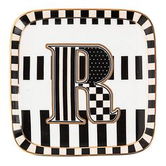 a black and white plate with the letter b on it