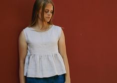 "Linen crop top NORA - sleeveless linen blouse features crew neck and empire waist with ruffle bottom. Perfect for warm summer days and casual everyday outings. FABRIC: 100% pre-washed softened linen, 205 g/m2, 6 oz/yd2 OEKO-TEX standards certified linen The length of this top is around 21.2 inches (54 cm). Model is wearing S size in color - Silver. The model is 5'6\"/169 cm - bust 34.2in/87cm, waist 28.3in/72cm, hips 37in/94cm. Model usually wears S or M size. Size chart and color options can b Sleeveless Ruffle Crop Top For Summer, Sleeveless Ruffled Crop Top For Summer, White Sleeveless Peplum Top Casual, Casual Ruffled Crop Tank Top, Casual Ruffle Tank Crop Top, Chic Sleeveless Ruffled Crop Top, Casual Ruffled Cropped Tops, Casual Cropped Ruffle Tops, Summer Ruffle Crop Tank Top