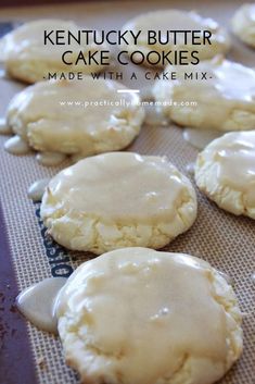 some cookies are sitting on a baking sheet and covered in icing, with the words kentucky butter cake cookies made with a cake mix